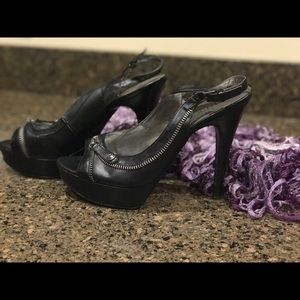 Black leather Guess 4 in heel shoes.  Like new